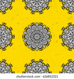 Carving. Element woodcarving. Luxury furniture. Patina. Furniture in classic style. Yellow tree with dim trim. Small depth of field. Pattern on yellow background with gray elements.