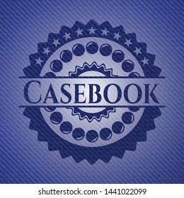 Casebook emblem with denim high quality background. Vector Illustration. Detailed.