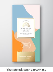 Cashew Chocolate Label. Abstract Vector Packaging Design Layout with Soft Realistic Shadows. Modern Typography, Hand Drawn Nut Silhouette and Colorful Background. Isolated.