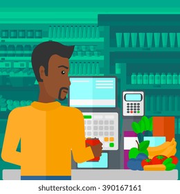 Cashier at supermarket checkout.