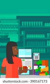 Cashier at supermarket checkout.