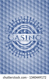 Casing blue emblem or badge with geometric pattern background.