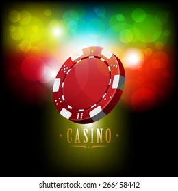 Casino chip on shiny background with bokeh