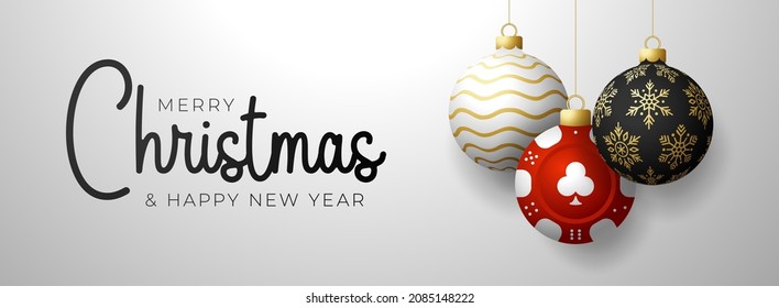 Casino Poker Christmas card. Merry Christmas sport greeting card. Hang on a thread casino poker chip as a xmas ball and golden bauble on gray background