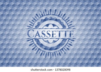 Cassette blue emblem with geometric pattern.