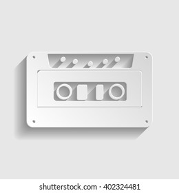 Cassette icon, audio tape sign. Paper style icon with shadow on gray. Paper cassette. Cassette vector illustration.