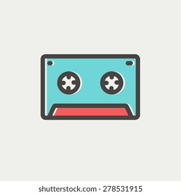 Cassette tape icon thin line for web and mobile, modern minimalistic flat design. Vector icon with dark grey outline and offset colour on light grey background.
