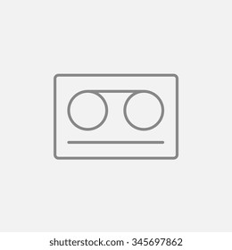 Cassette tape line icon for web, mobile and infographics. Vector dark grey icon isolated on light grey background.