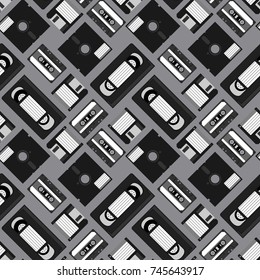 Cassette tape,video Home System, 5¼ inch floppy disk and 3½ inch floppy disk seamless pattern background vector.