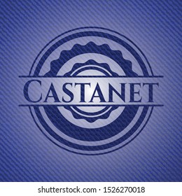 Castanet badge with jean texture. Vector Illustration. Detailed.