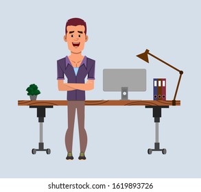 casual businessman stands near his table or workplace