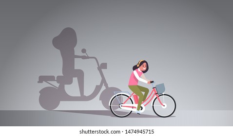 casual girl riding bike shadow of woman on motor scooter imagination aspiration concept female cartoon character full length flat horizontal