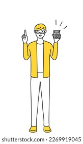 A casually dressed young man holding a calculator and pointing.