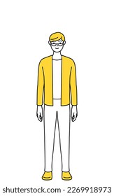 A casually dressed young man, standing