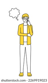 A casually dressed young man thinking while scratching his face.