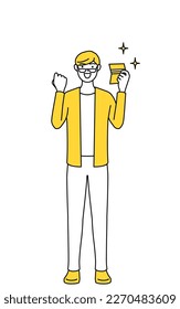 A casually dressed young man who is pleased to see a bankbook.