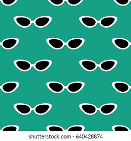 Cat eye sunglasses seamless pattern on the green background. Vector illustration