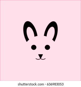 cat face animal cute expression icon in black color on a light pink background