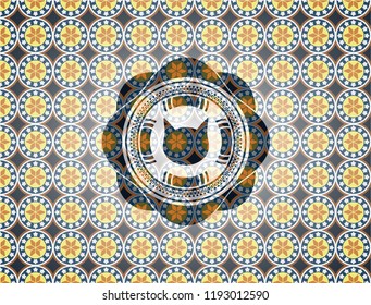 cat face icon inside arabic emblem background. Arabesque decoration.