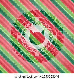 cat face icon inside christmas colors badge.