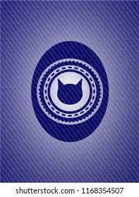 cat face icon inside denim background