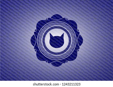 cat face icon inside denim background