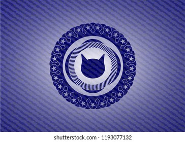cat face icon inside emblem with jean texture