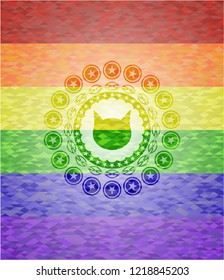 cat face icon inside emblem on mosaic background with the colors of the LGBT flag