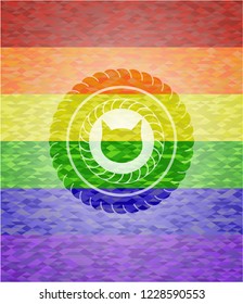 cat face icon inside emblem on mosaic background with the colors of the LGBT flag