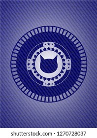 cat face icon inside emblem with denim high quality background