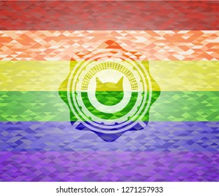 cat face icon inside emblem on mosaic background with the colors of the LGBT flag