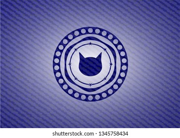 cat face icon inside emblem with denim high quality background