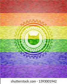 cat face icon inside emblem on mosaic background with the colors of the LGBT flag