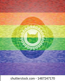 cat face icon inside emblem on mosaic background with the colors of the LGBT flag
