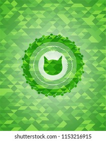cat face icon inside green emblem. Mosaic background