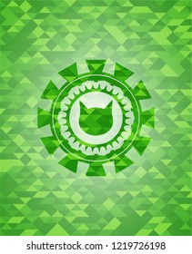 cat face icon inside green emblem. Mosaic background