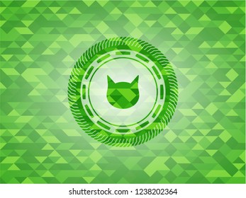 cat face icon inside green mosaic emblem