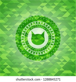 cat face icon inside green mosaic emblem