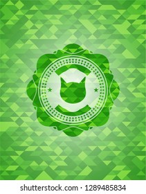 cat face icon inside green mosaic emblem