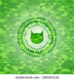 cat face icon inside green emblem. Mosaic background
