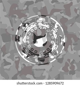 cat face icon inside grey camouflaged emblem