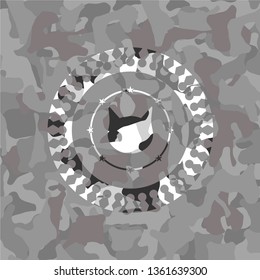 cat face icon inside grey camouflage emblem