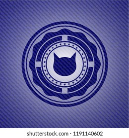 cat face icon inside jean or denim emblem or badge background