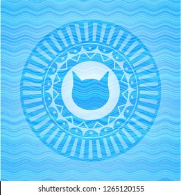 cat face icon inside light blue water wave badge background.