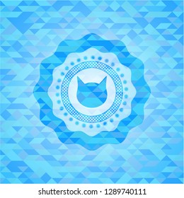 cat face icon inside light blue mosaic emblem