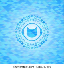 cat face icon inside light blue emblem with mosaic background