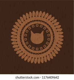 cat face icon inside realistic wood emblem