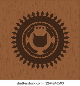 cat face icon inside realistic wood emblem