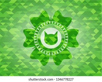 cat face icon inside realistic green emblem. Mosaic background