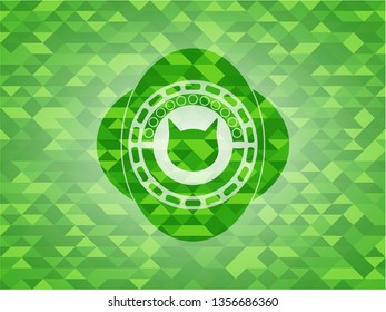 cat face icon inside realistic green emblem. Mosaic background